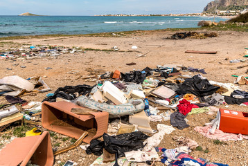 Coastal degradation with dirty beach, rubbish and domestic waste polluting the Capaci beach in...
