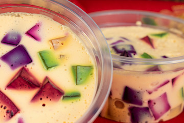 Christmas jelly, sweet very famous in Brazil. Brazilian Christmas colorful candy on the table on the red table cloth.