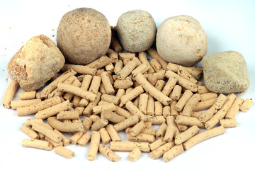 Persian kashk, made from drained sour milk or yoghurt, by forming and letting it dry.