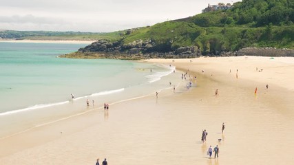 Families enjoying a hot summer day on Porthminster beach in St Ives, Cornwall, England.