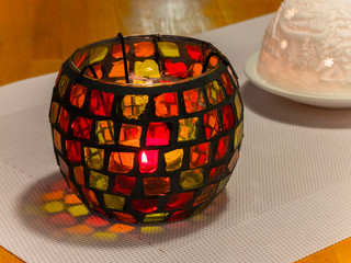 Little candle in nice color cup on the table, Czech Republic