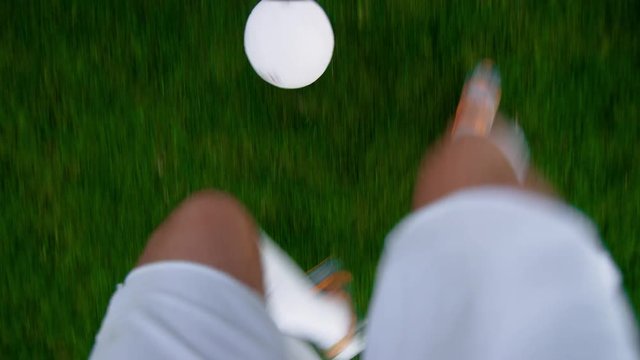 Point of View Shot of Professional Soccer Player Dribbling the Ball, overtaking His Opponents. POV with Focus on Legs.