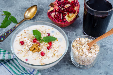 Healthy delicious muesli with oatmeal and pomegranat