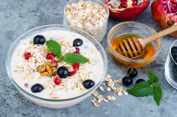 Healthy delicious muesli with oatmeal and pomegranat