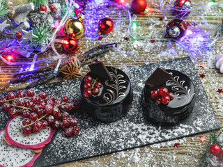 chocolate cake with red currants. dessert on the table close up. New Year christmas composition,decoration.