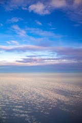 Fototapeta na wymiar Blue sky with white clouds view from the plane.
