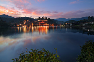 Obraz premium Beautiful scenery during twilight of Yunnan Chinese Village is located on the hill at Ban Rak Thai , Mae Hong Son in Thailand.This is very popular for photographers and tourists.