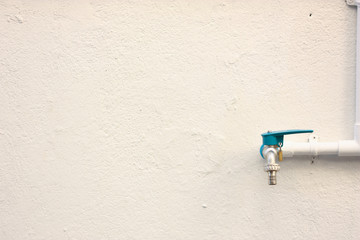 blue cap pipe on the wall