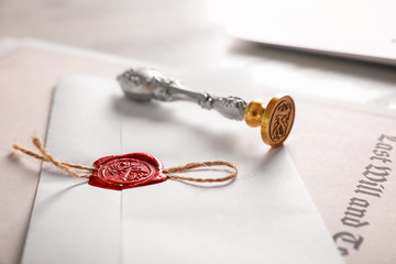 Vintage notary stamp and documents on desk, closeup