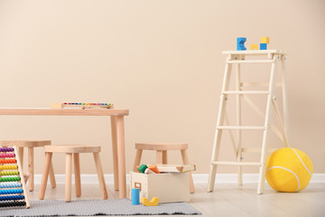 Stylish child's room interior with toys and new furniture