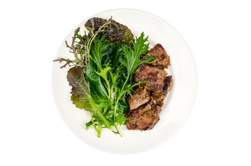 Slices of fried liver, green leaves of salads