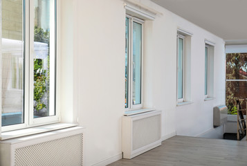 Fototapeta na wymiar Modern windows in light empty room. Home interior