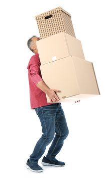 Mature man carrying carton boxes on white background. Posture concept