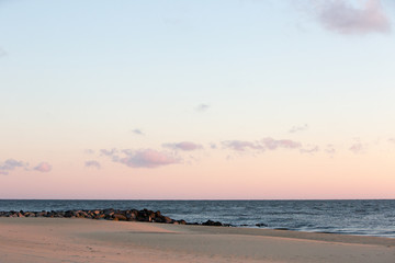 coastal sunrise rock jetty