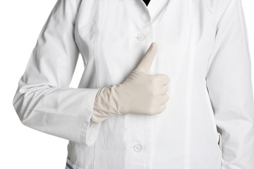 Doctor in medical glove showing thumb-up gesture on white background