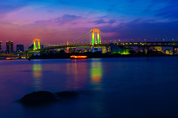 Colorful illuminations at Rainbow Bridge from Odaiba in Tokyo, Japan