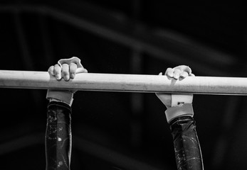 Young gymnast on a horizontal bar