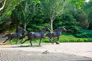 Fototapeta premium Running horse sculpture in the Yuan Dynasty sand-layered site park, Beijing, China