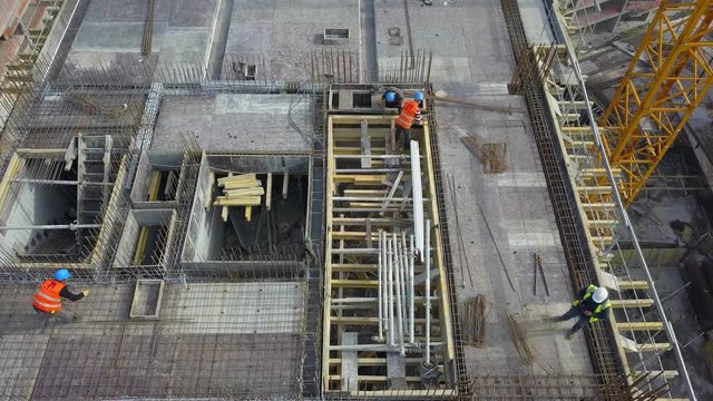 ISTANBUL - TURKEY 10 JULY 2017 -Aerial view of construction workers work on top of the building at construction site 2