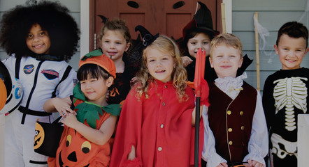 Little children trick or treating on Halloween