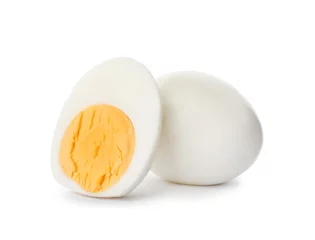 Fototapeten Sliced and whole hard boiled eggs on white background © New Africa