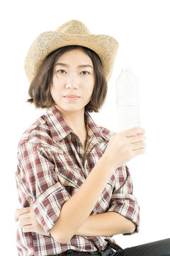 Woman in a plaid shirt holding a water bottle on white background