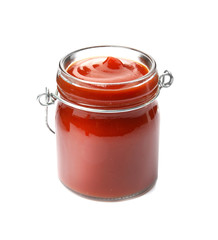 Tasty homemade tomato sauce in glass jar on white background