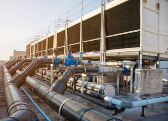 A set of cooling towers in a data center building is installed on the roof.