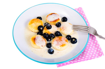 Curd products in sweet sauce with berries