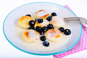 Curd products in sweet sauce with berries