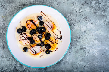 Curd products in sweet sauce with berries