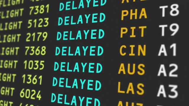 A close up view of an airport's travel information board with flights being delayed, possibily due to bad weather conditions.  	