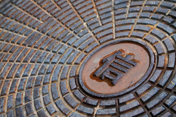 "letter" words written on the manhole cover