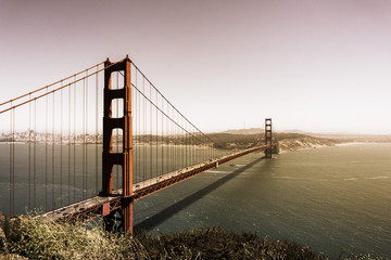 Beautiful view of Golden Gate Bridge on a sunny day with soft light and warm colors; California