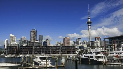 NEW ZEALAND, AUCKLAND - March 29, 2018: Timelapse video of Auckland city centre and docks with luxurious yachts on sunny summer day. Illustrative editorial footage.
