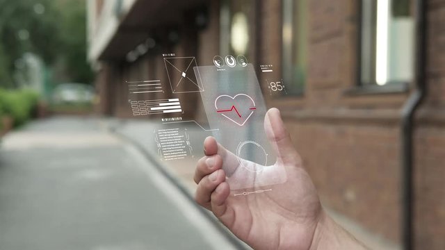 Futuristic medicine. Man using smartphone with futuristic touching screen. Heartbeat. Pulse. Augmented reality and network. Multimedia technology. Future is now