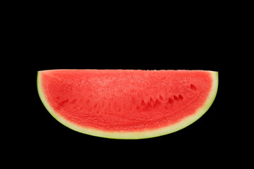 Sliced sweet watermelon isolated over black background.