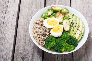 Buddha bowl with quinoa , eggs , avocado , brussels sprouts and broccoli