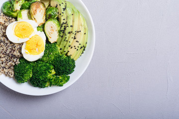 Buddha bowl with quinoa , eggs , avocado , brussels sprouts and broccoli