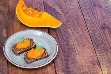 Vegetable caviar from pumpkin and zucchini on wooden table