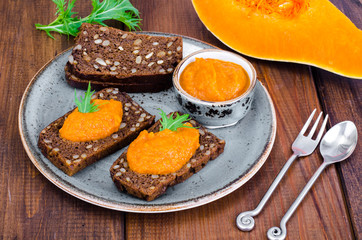 Vegetable caviar from pumpkin and zucchini on wooden table