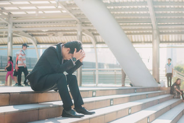 Businessman of stress in city.