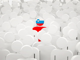 Fototapeta premium Man with flag of slovenia in a crowd