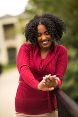 Beautiful woman smiling looking at her engagement ring.