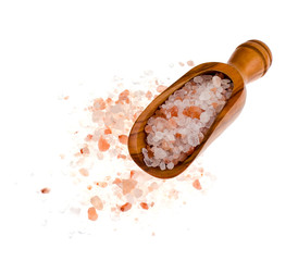 Sea salt in wooden scoop isolated on white background
