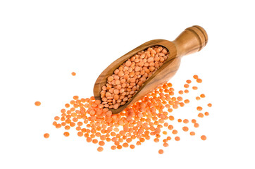 Red lentils in wooden scoop, isolated on white background,  healthy food