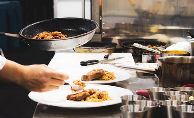 Chef preparing food, meal, in the kitchen, chef cooking, Chef decorating dish, closeup, .Chef preparing food, meal, in the kitchen, chef cooking, Chef decorating dish, closeup, .