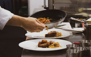 Chef preparing food, meal, in the kitchen, chef cooking, Chef decorating dish, closeup, .Chef preparing food, meal, in the kitchen, chef cooking, Chef decorating dish, closeup, .