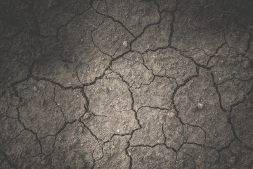 dried cracked ground, dark soil,Global warming and arid Concept,disaster