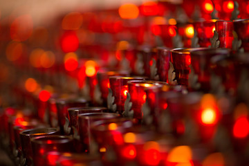 Red candles in a church with copy space.